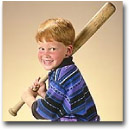 child with a baseball bat