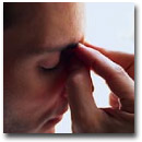 A man troubled by a sinus headache.